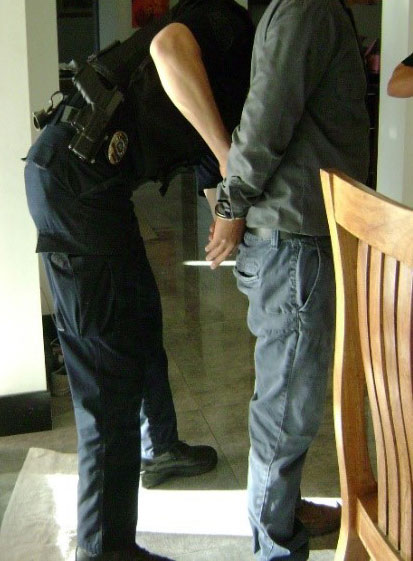 Unidentified suspect being detained
